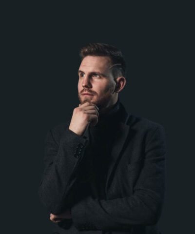 man-in-black-suit-jacket-full-width man-in-black-suit-jacket-full-width
